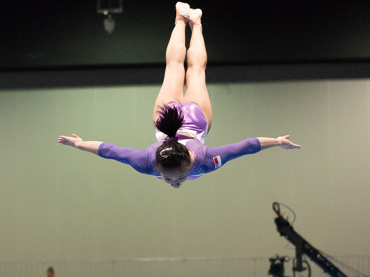 girl performing at gymnastics competition