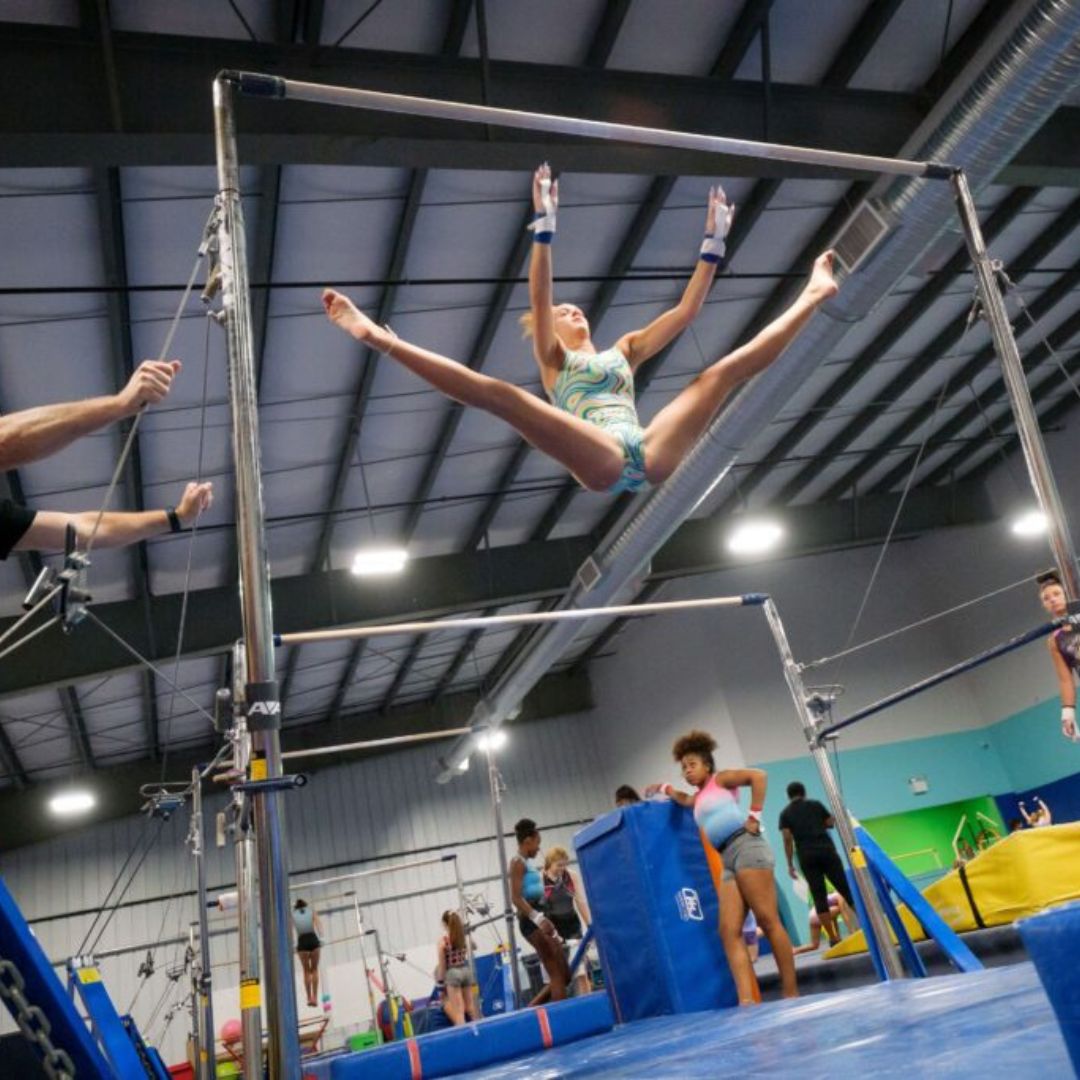Gymnast practicing uneven bars