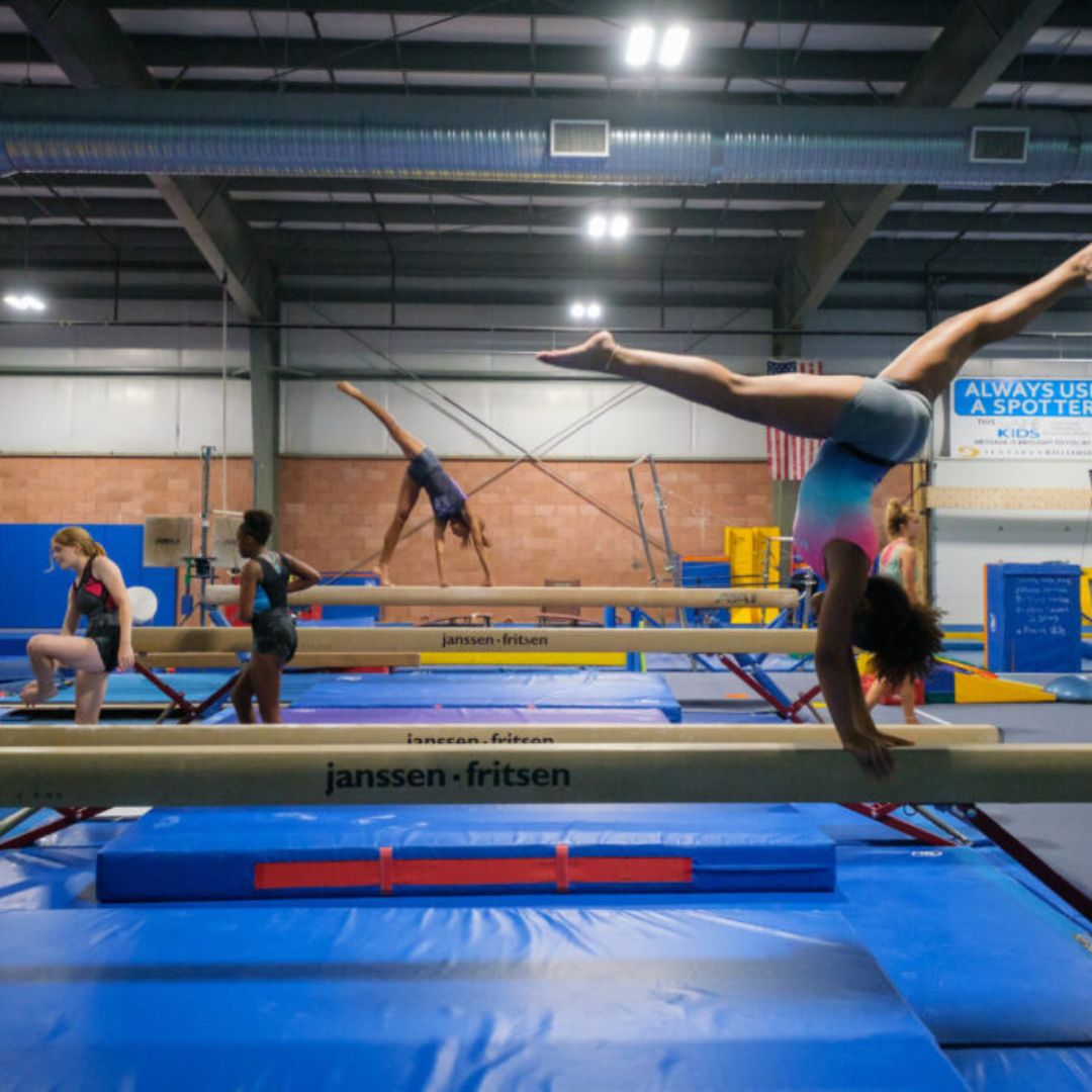 Gymnasts on balance beams