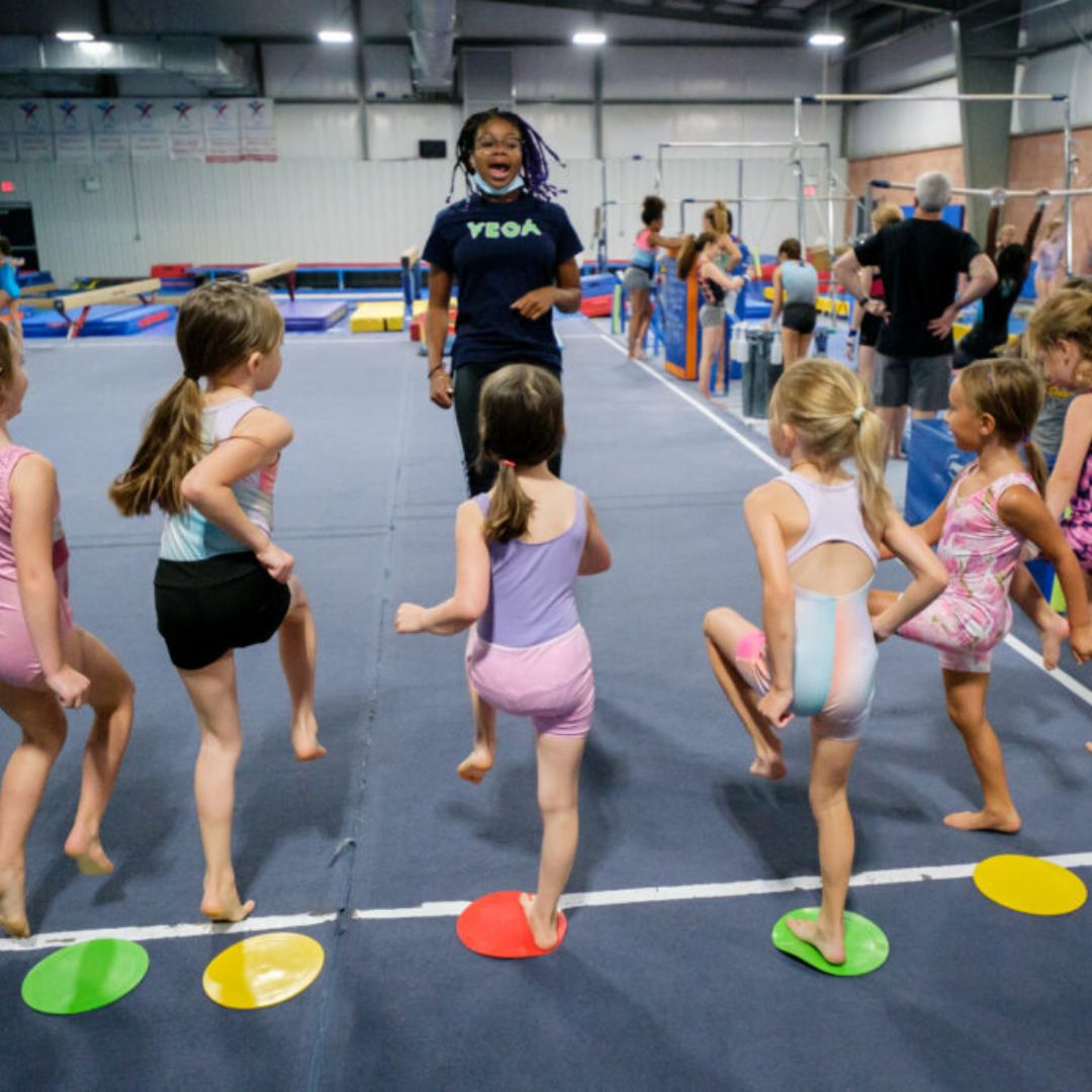 Young gymnasts getting insturction